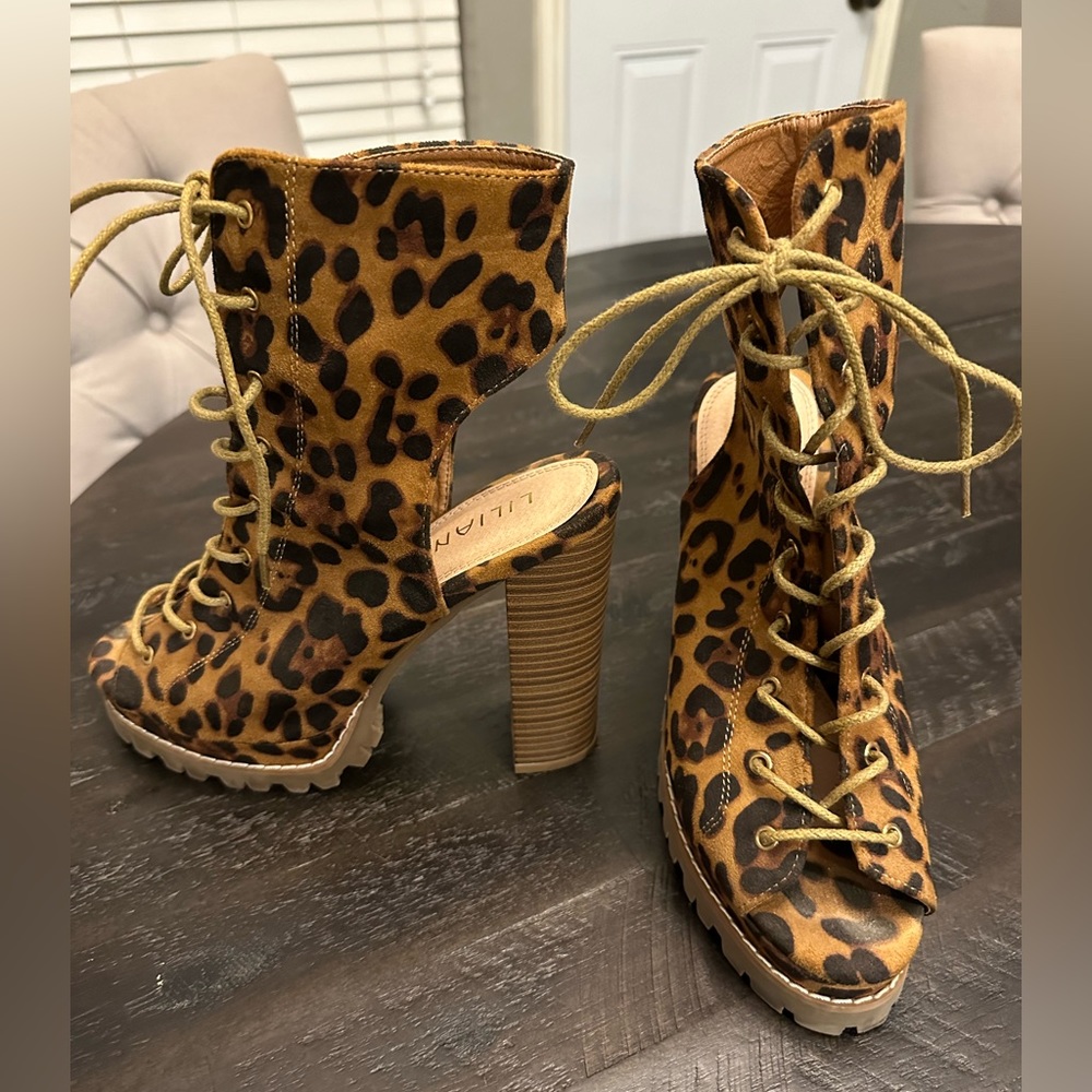 Lace up animal print open toe, open back heels. Womens size 7.5. A must have!